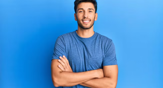 young-handsome-man-wearing-casual-tshirt-blue-background-happy-face-smiling-with-crossed-arms-looking-camera-positive-person_839833-12963